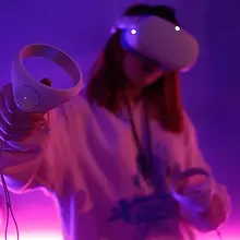 Woman using VR headset and controllers